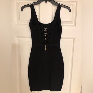 Black dress with gold hooks on back